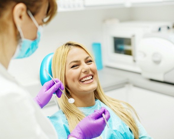 Woman laughing during dental appointment