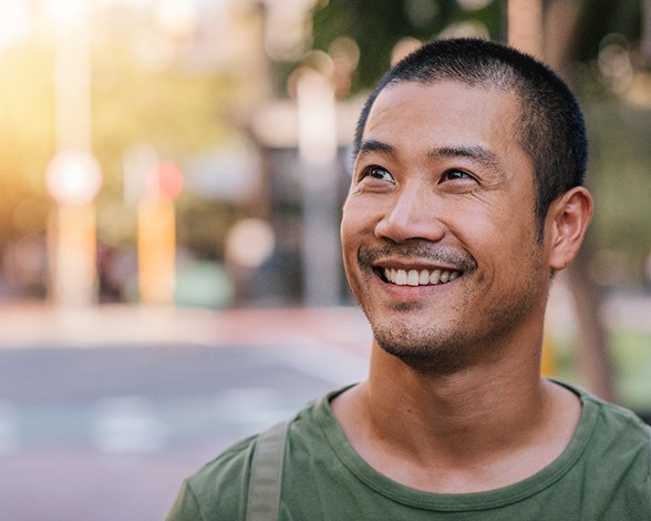 Man smiling with a dental bridge in Pacoima