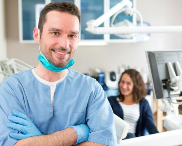 Smiling dentist in dental office