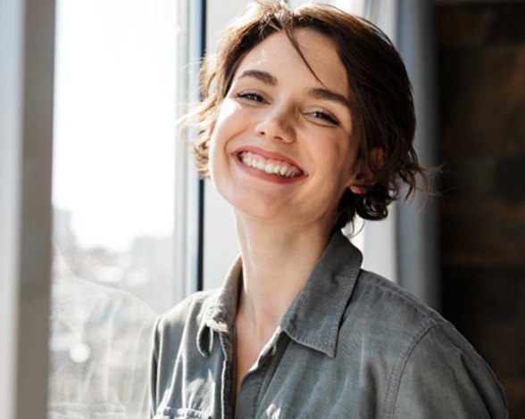 Woman smiling with a dental crown in Pacoima