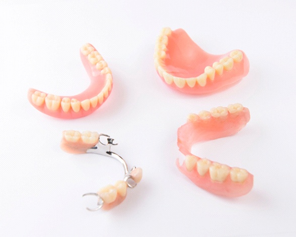 Multiple kinds of dentures in Pacoima, CA on table