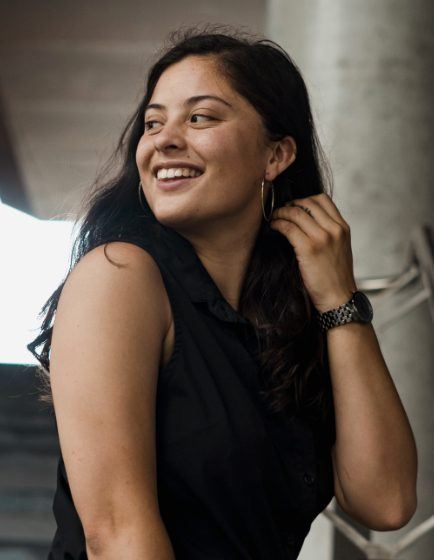 Smiling woman with silver hoop earrings