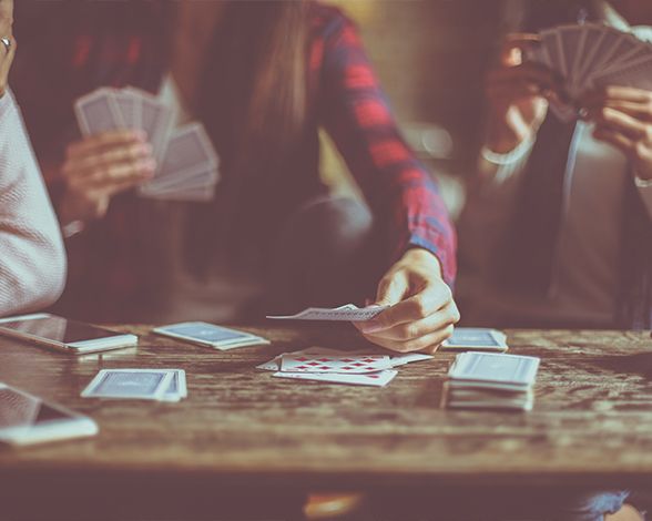 Group of friends playing cards