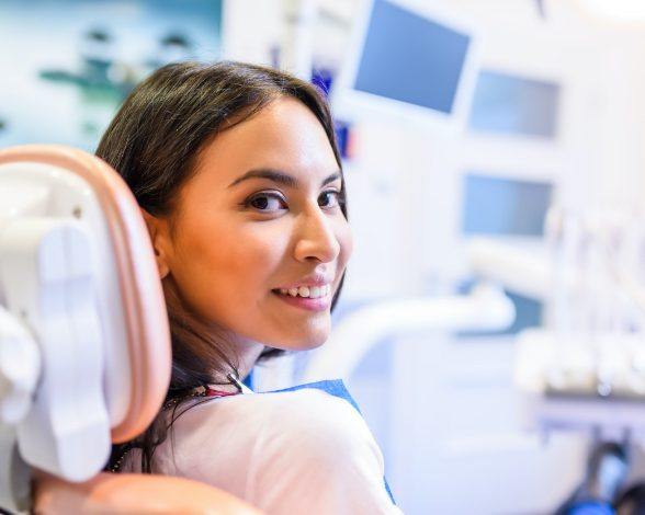 Woman smiling during preventive dentistry checkup and teeth cleaning