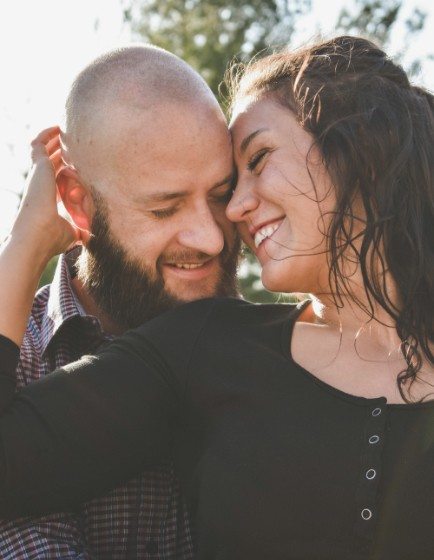 Man and woman with flawless smiles after cosmetic dentistry