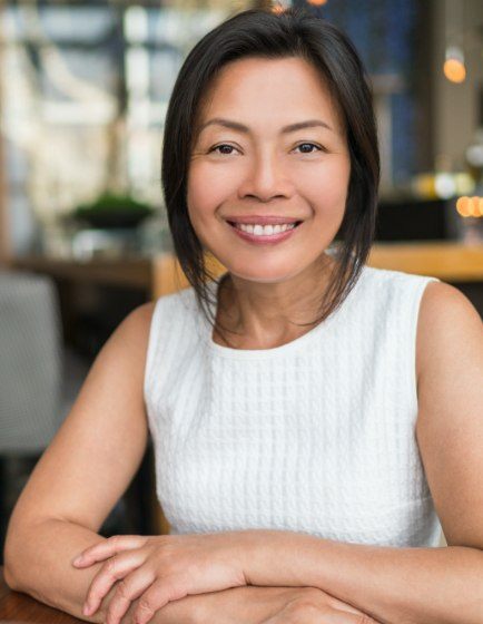 Woman smiling after sedation dentistry visit