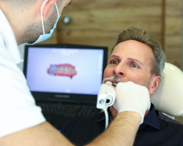 Dentist capturing bite impressions with Trios digital impression system